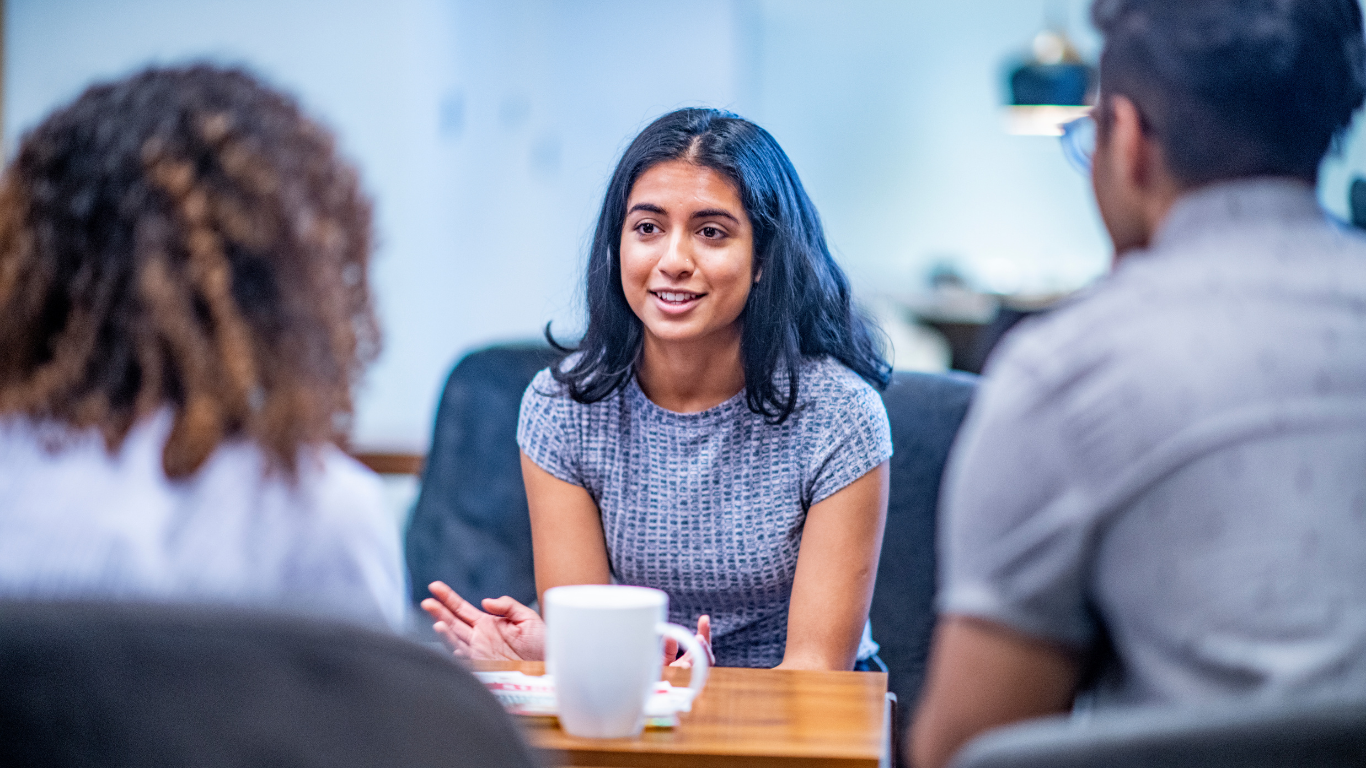 A female therapist provides couples counselling for a young man and woman.