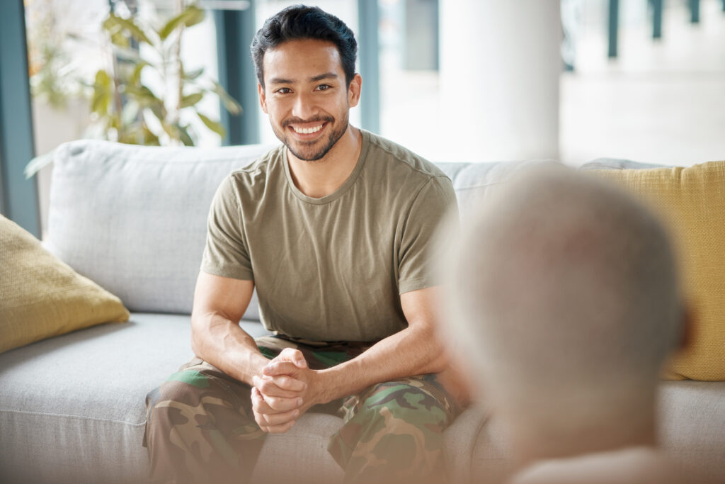 An adult man smiles in relief after his ADHD assessment.