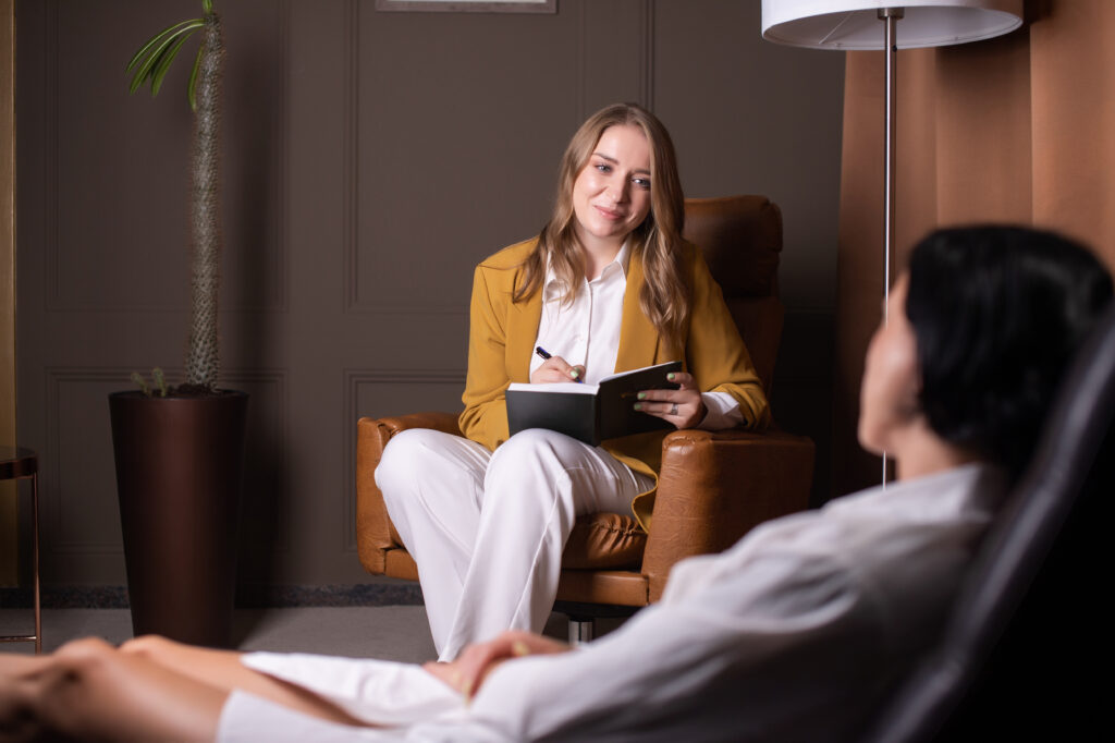 Psychologist working with patient.